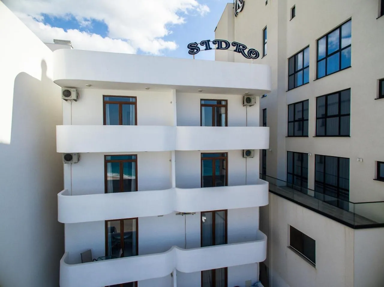 The Apartments Sidro house on the beach promenade